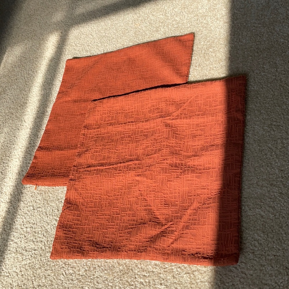 2 burnt orange pillow covers